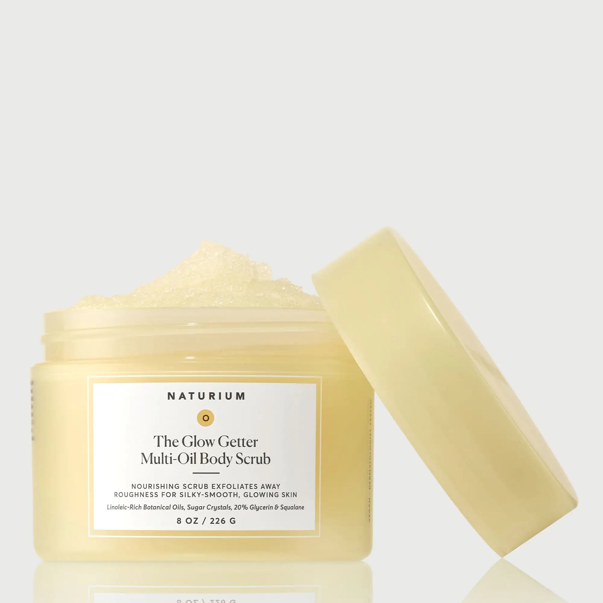the-glow-getter-multi-oil-body-scrub-b6 NATR-40028-GlowGetter-Multi-Oil-Body-Scrub-Front-CapOff-bonebkgd.webp